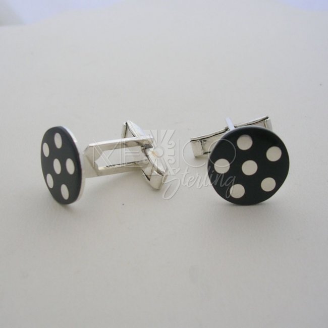 Sterling Silver Cufflinks and Black Background